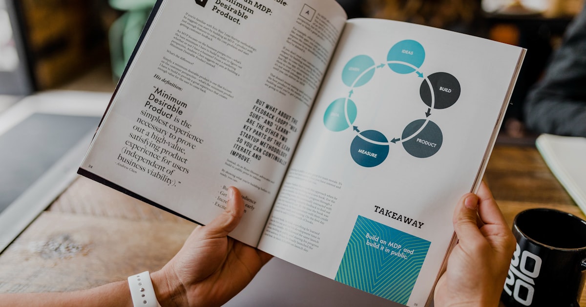 Content creator writing blog posts on a laptop in a modern office